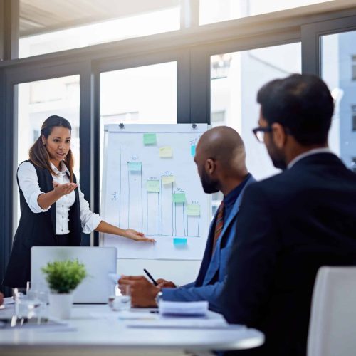 A woman leading a presentation during a meeting.